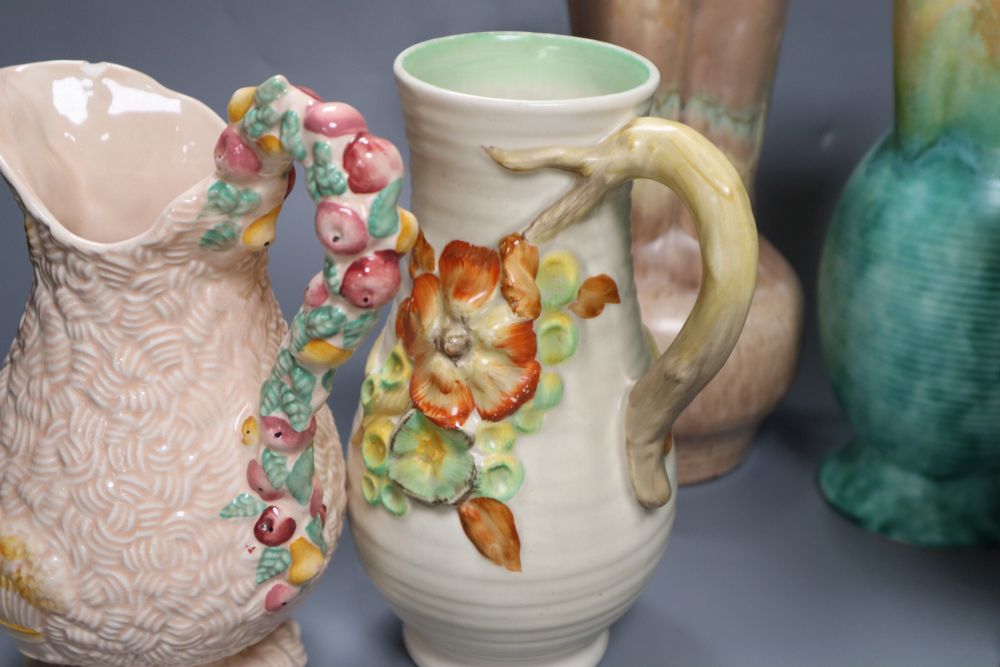 A group of post-war Clarice Cliff including a My Garden vase and jug, Water Lily bowl, 21cm wide, Celtic Harvest jug and two 1930s jugs